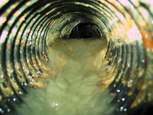 unclog basement drain using video pipeline inspection