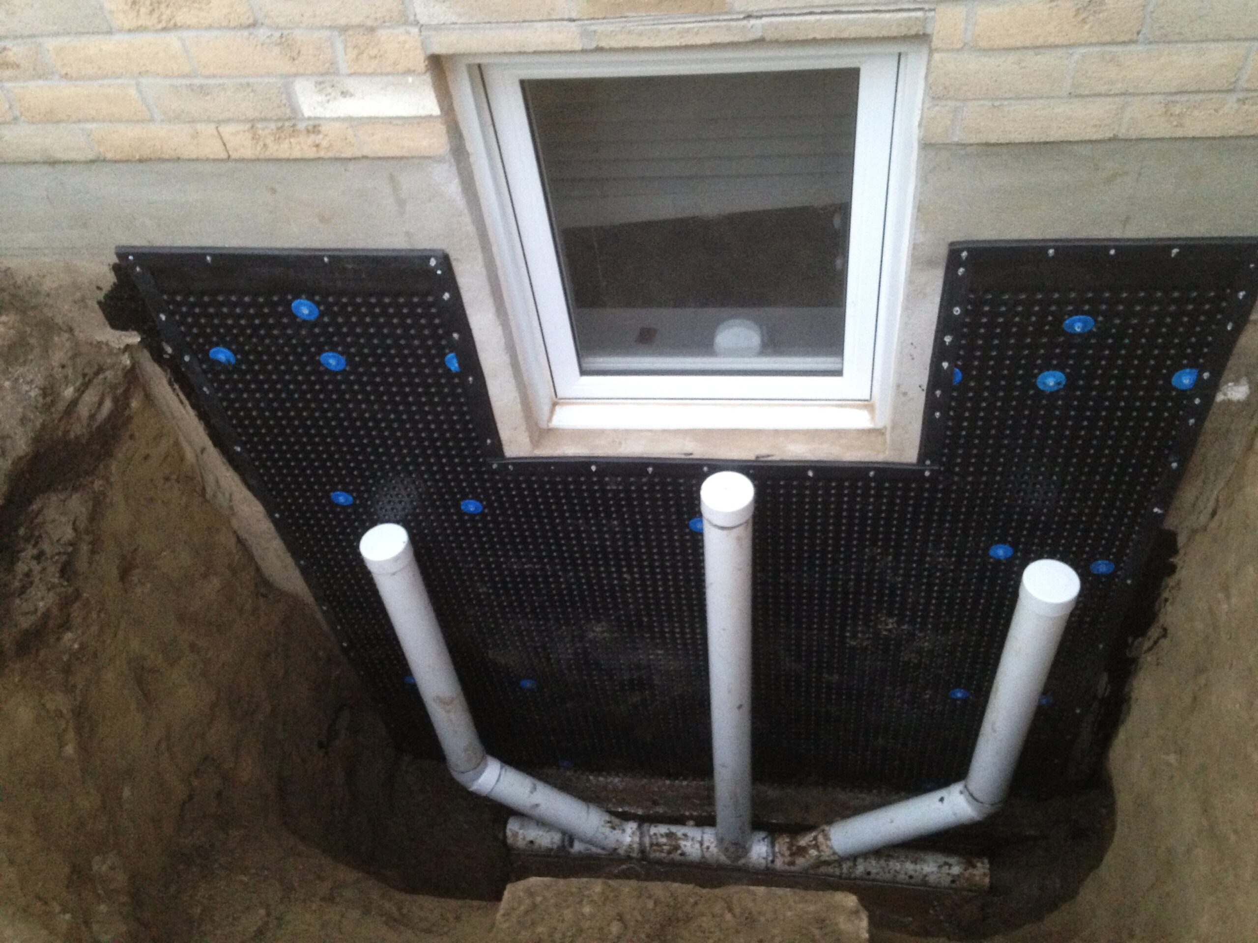 Wet Basement Window Well installation
